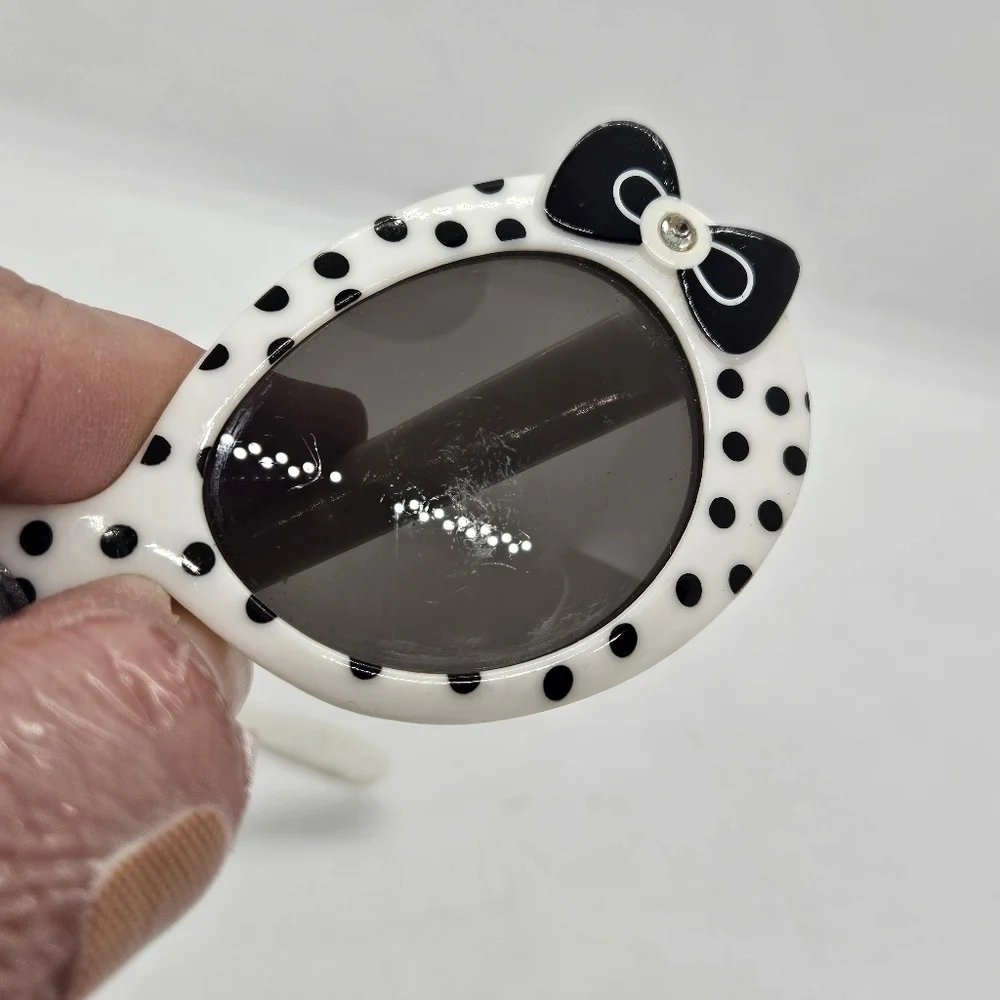 little girls white sunglasses with black polka dots and bows light flaw